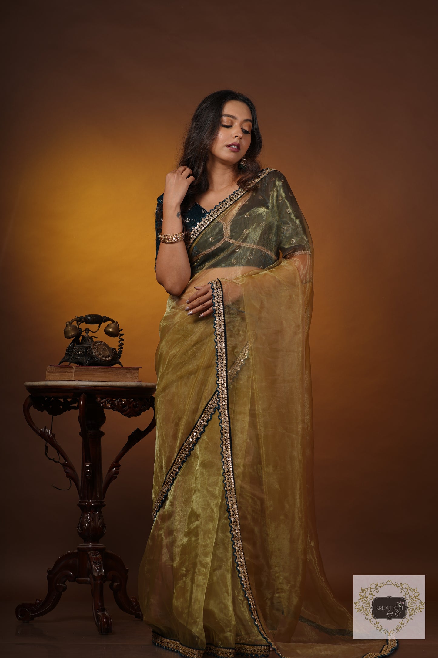 Pista Green Glass Tissue Saree with Teal Border