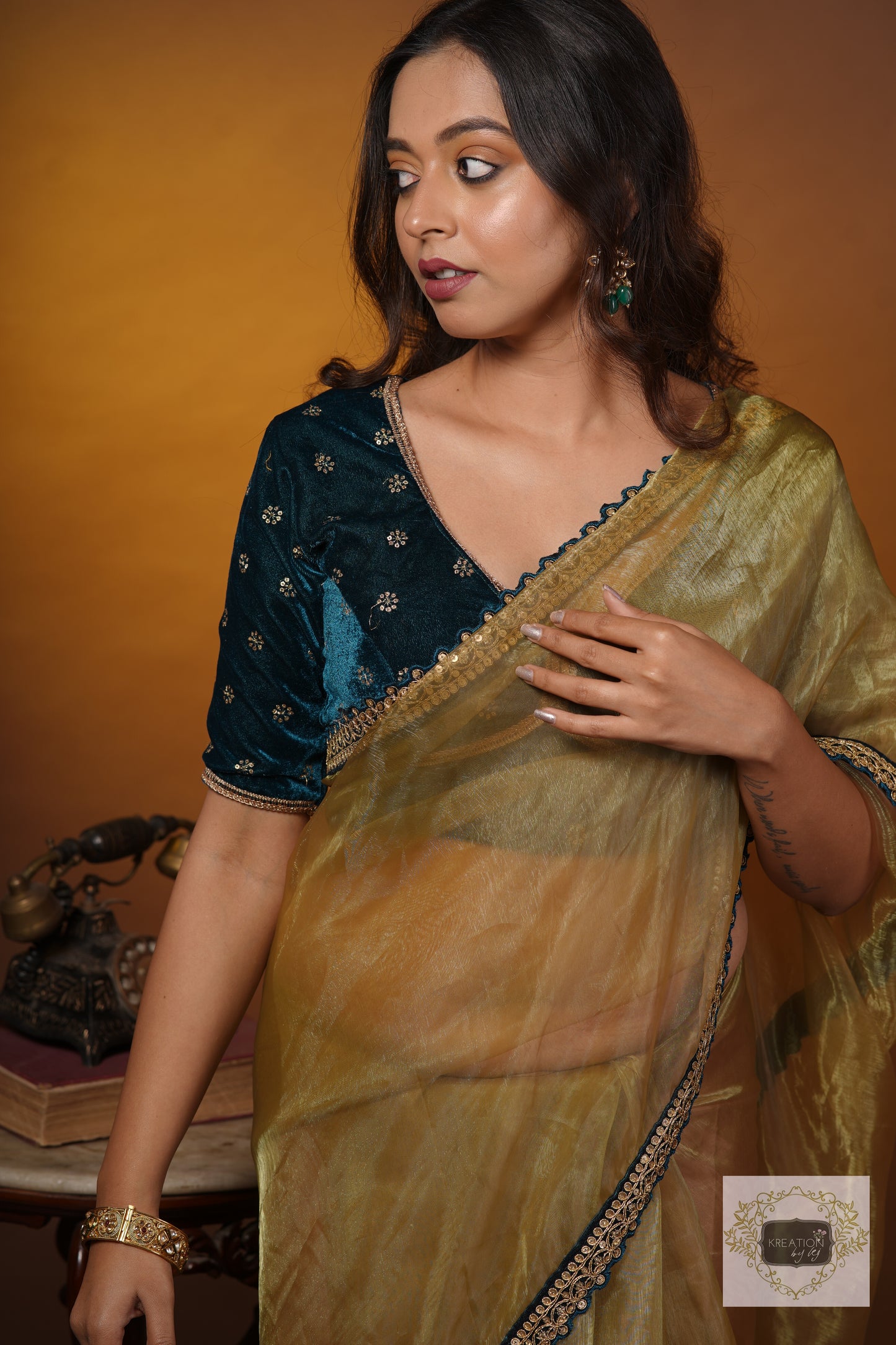 Pista Green Glass Tissue Saree with Teal Border