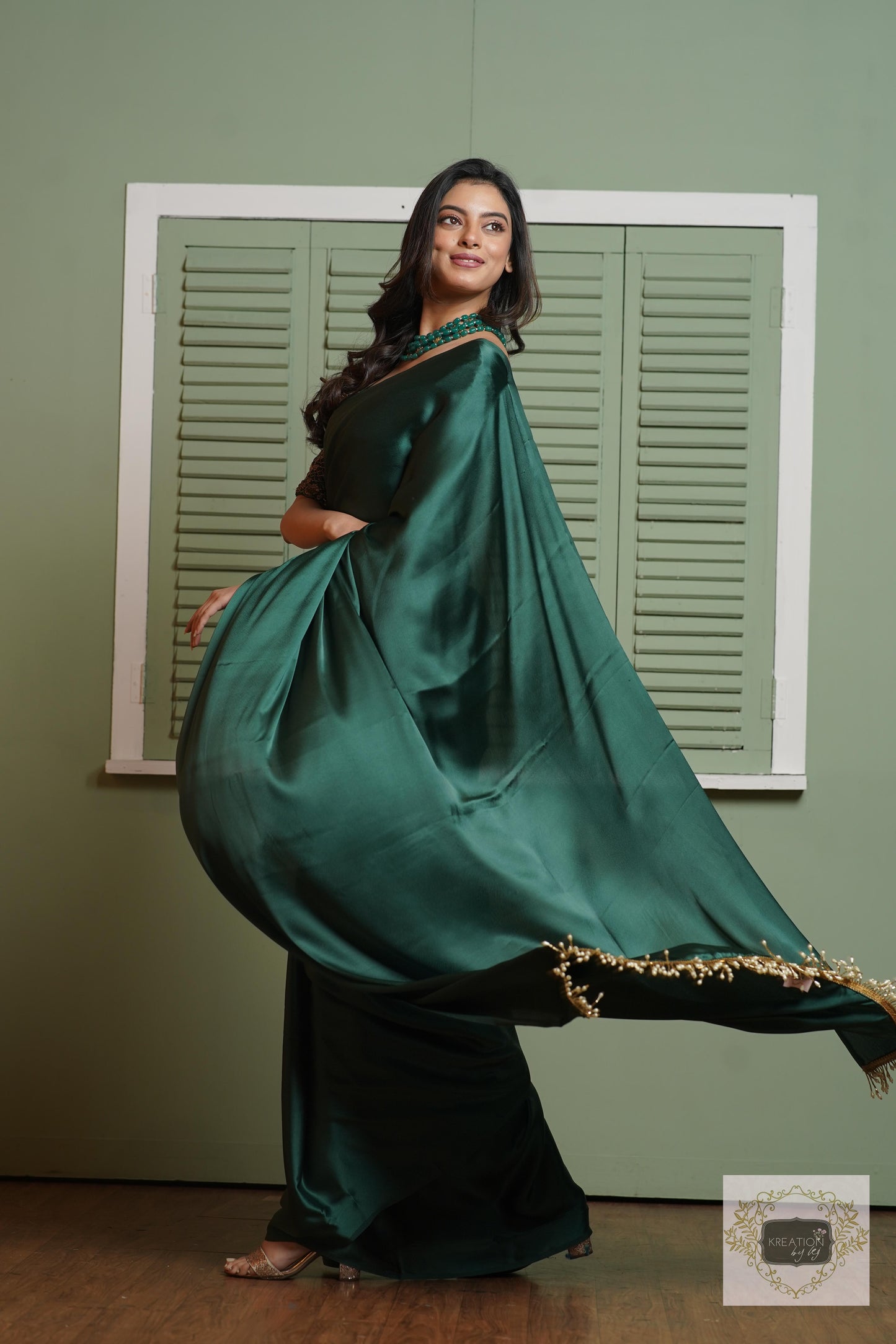Emerald Green Satin Silk Saree With Handmade Tassels On Pallu